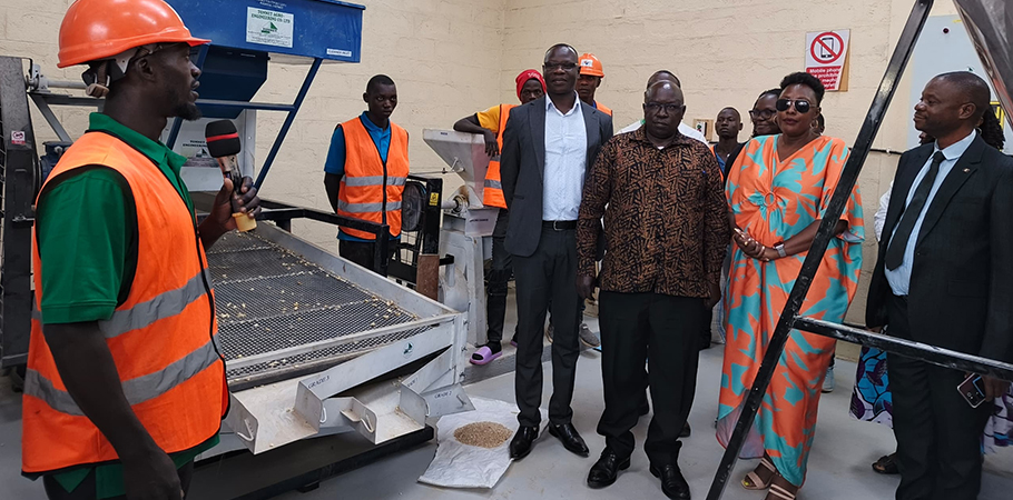Assistant Commissioner Yafesi Ogwang (centre), Felix Opio, Phoebe Namulindwa, Fred Kasirye and other leaders listen to a youth explaining how the machines work.